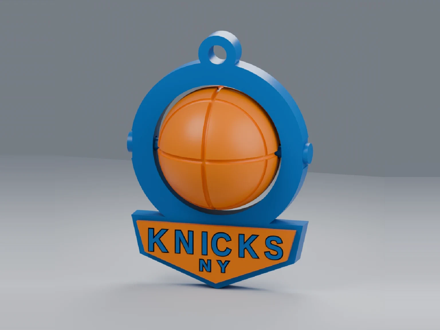 3D-printed basketball fidget spinner keychain with a blue ring, an orange ball and a badge
