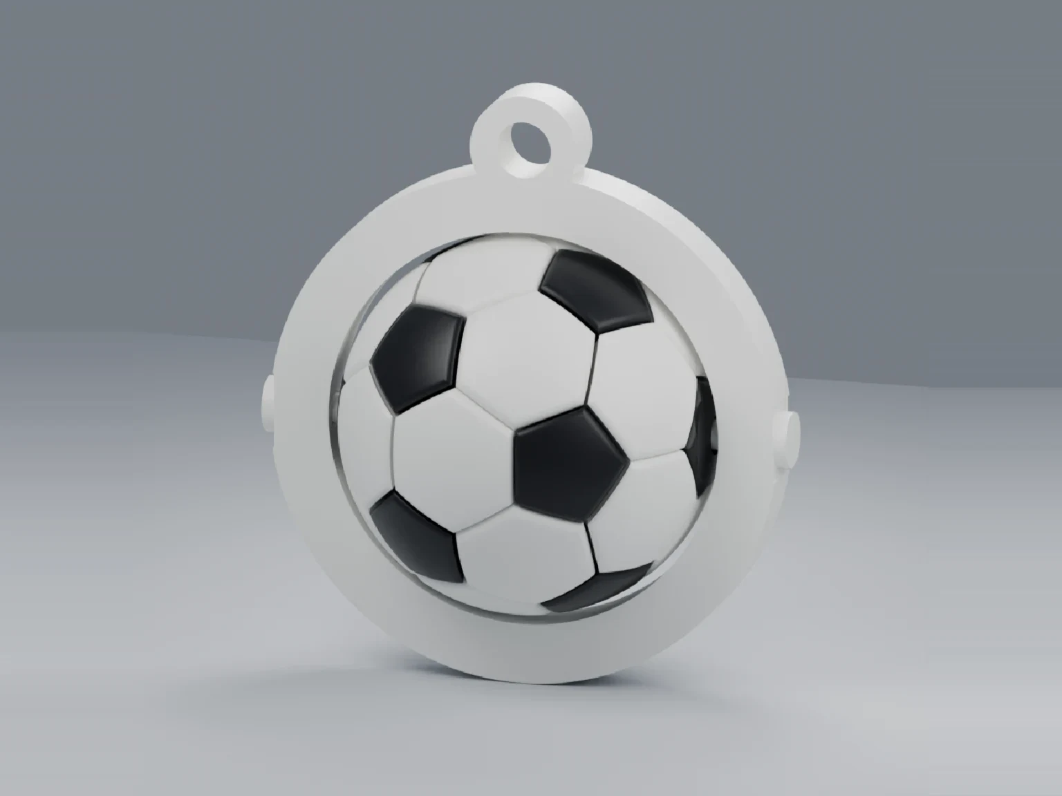 3D-printed football fidget spinner keychain with a white ring and a black-and-white ball